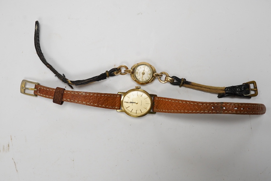 A lady's steel and gold plated Omega manual wind wrist watch, on an associated leather strap, together with a lady rolled gold Bucherer wrist watch. Condition - poor